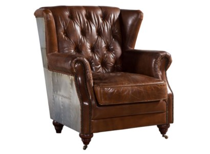 Красивое крылатое винтажное кресло из кожи темно-коричневого цвета