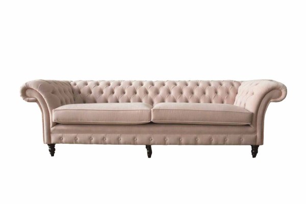 A Luxurious, pink four-seater Chesterfield sofa, INCLUDED seat cushion