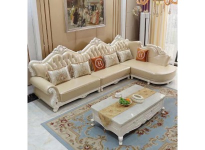 Дизайнерский угловой диван L-образной формы с обивкой из кожи и декоративными резными элементами