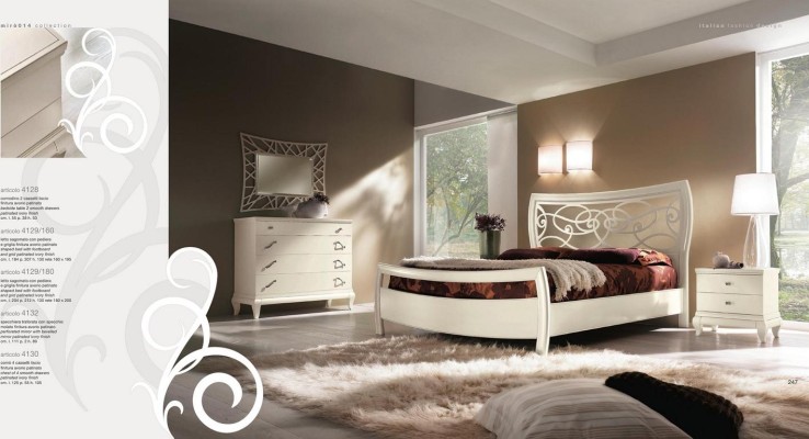 Белая двуспальная кровать из массива дерева с резным изголовьем