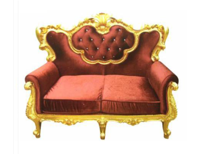 Chic 2-seater sofa with a bright color combination of elegant red and shiny gold tone in baroque style